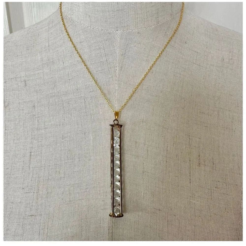 Gold tone long caged rhinestone necklace